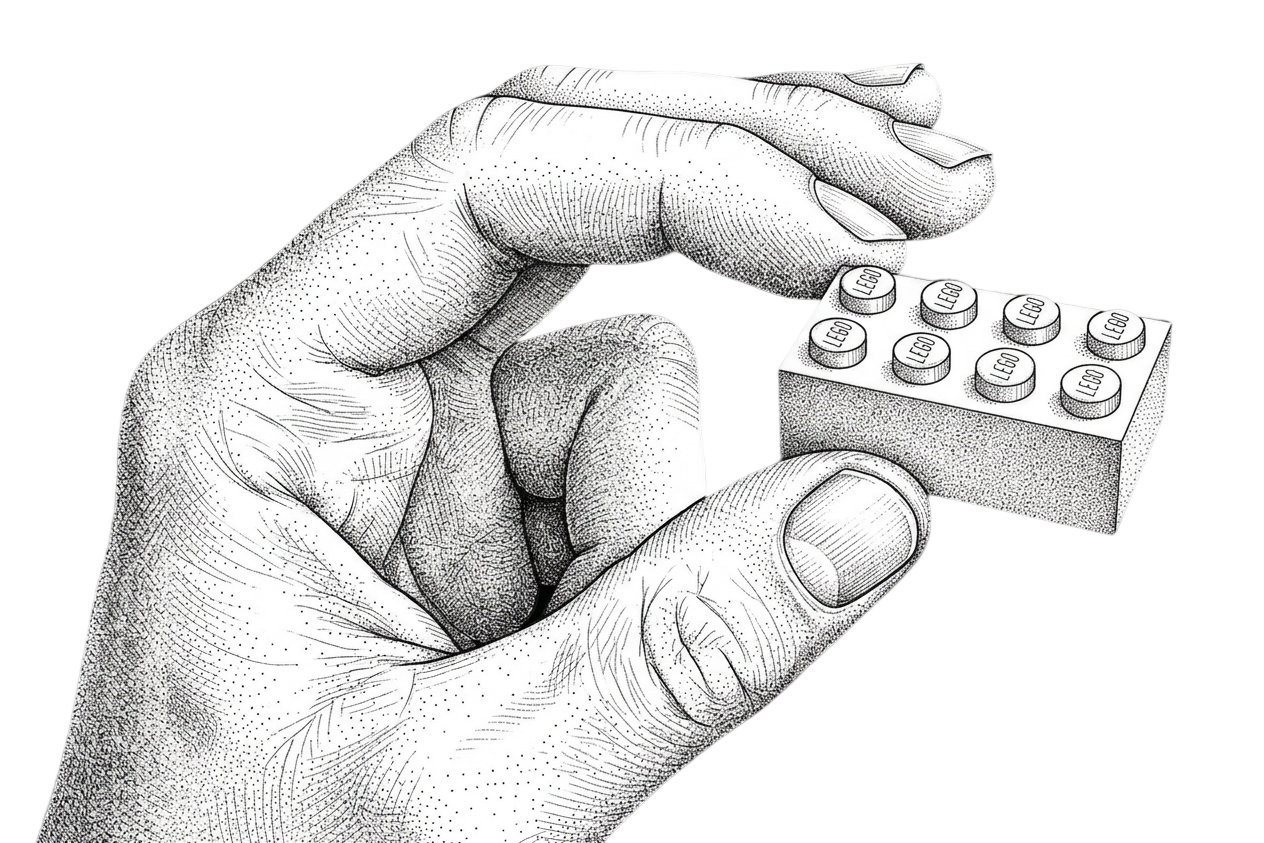 Hand holding a lego brick